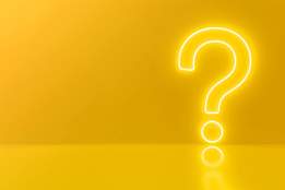 a neon question mark on a yellow background